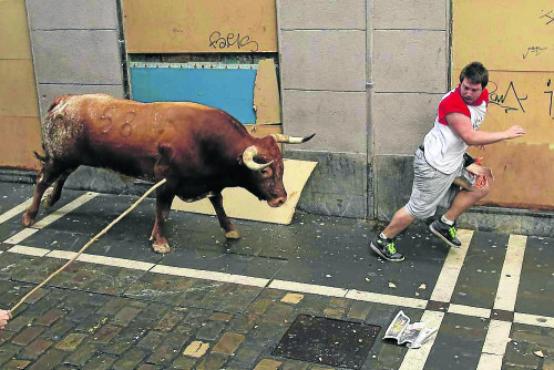 Australian tourist’s thigh ripped open by bull in Pamplona Australian tourist’s thigh ripped open by bull in Pamplona