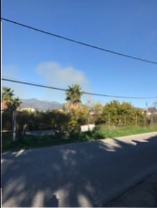 Smoke from a pile of burning leaves near to Jessica's home