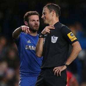 Referee Mark Clattenburg with Chelsea player Juan Mata