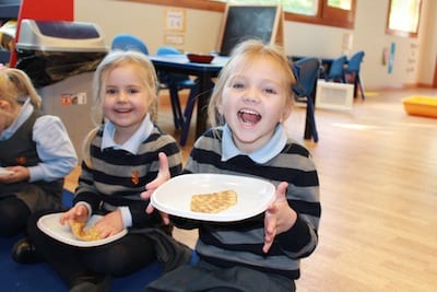 Sophie and India enjoying their pancakes