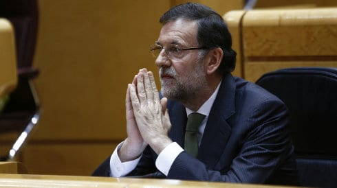 Rajoy praying e