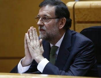 Rajoy praying e