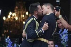 Two policeman embrace at the first ever gay police wedding