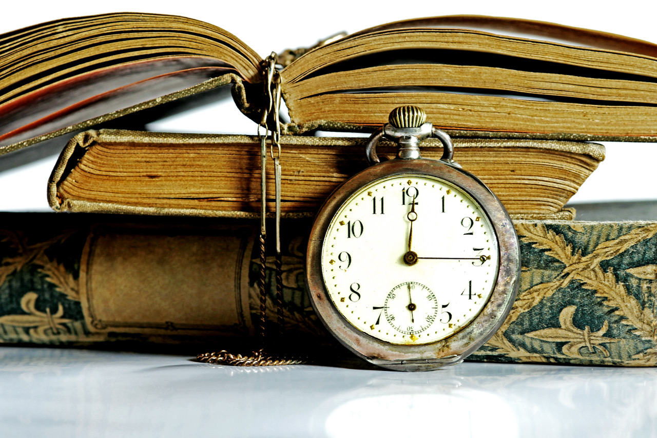 An Old Pocket Watch And Antique Books