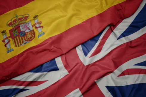 Waving Colorful Flag Of Great Britain And National Flag Of Spain