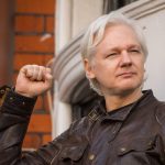 Julian Assange outside the Ecuadorian embassy in London