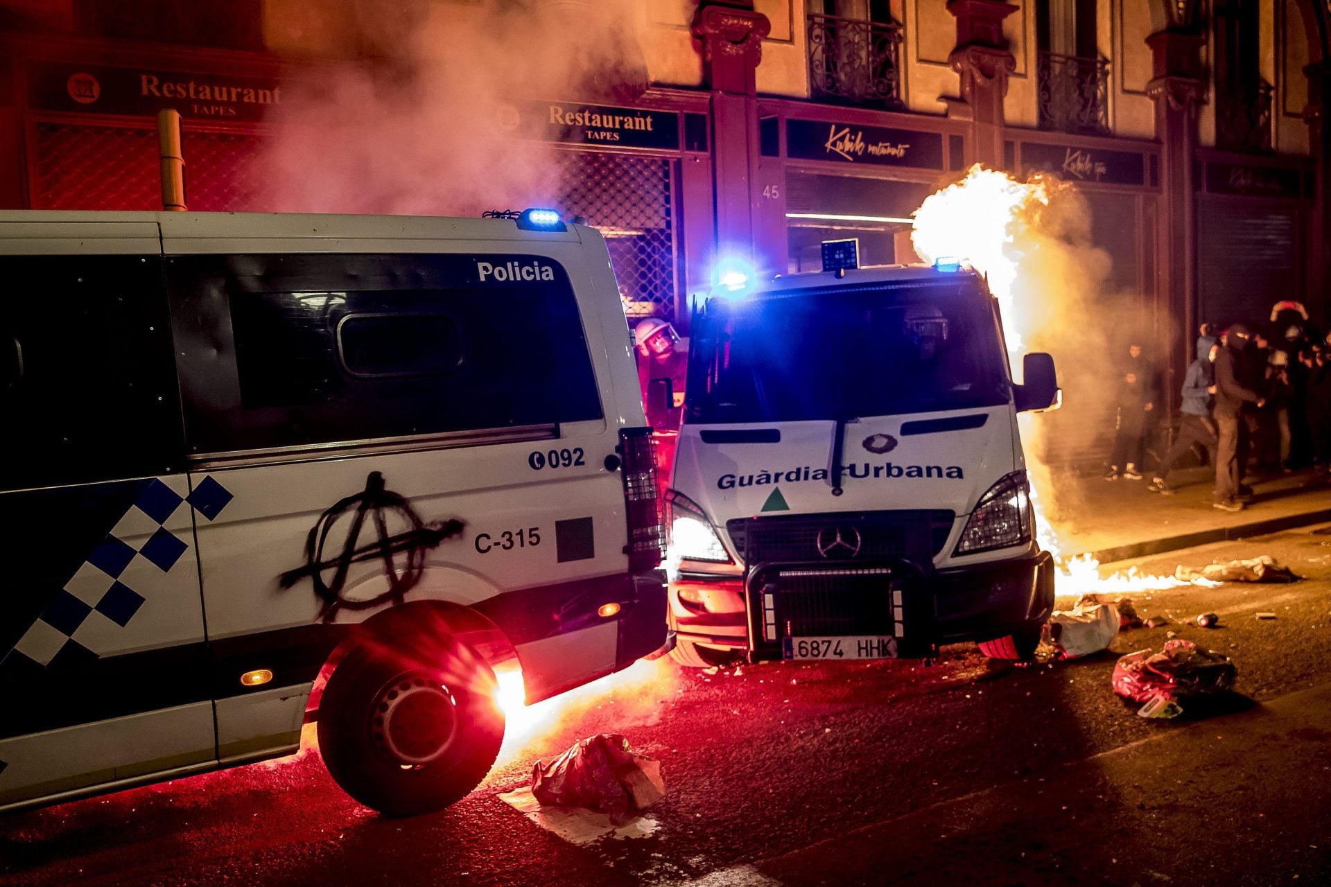 CROSSING THE LINE: Barcelona riots return as police car is set alight ...