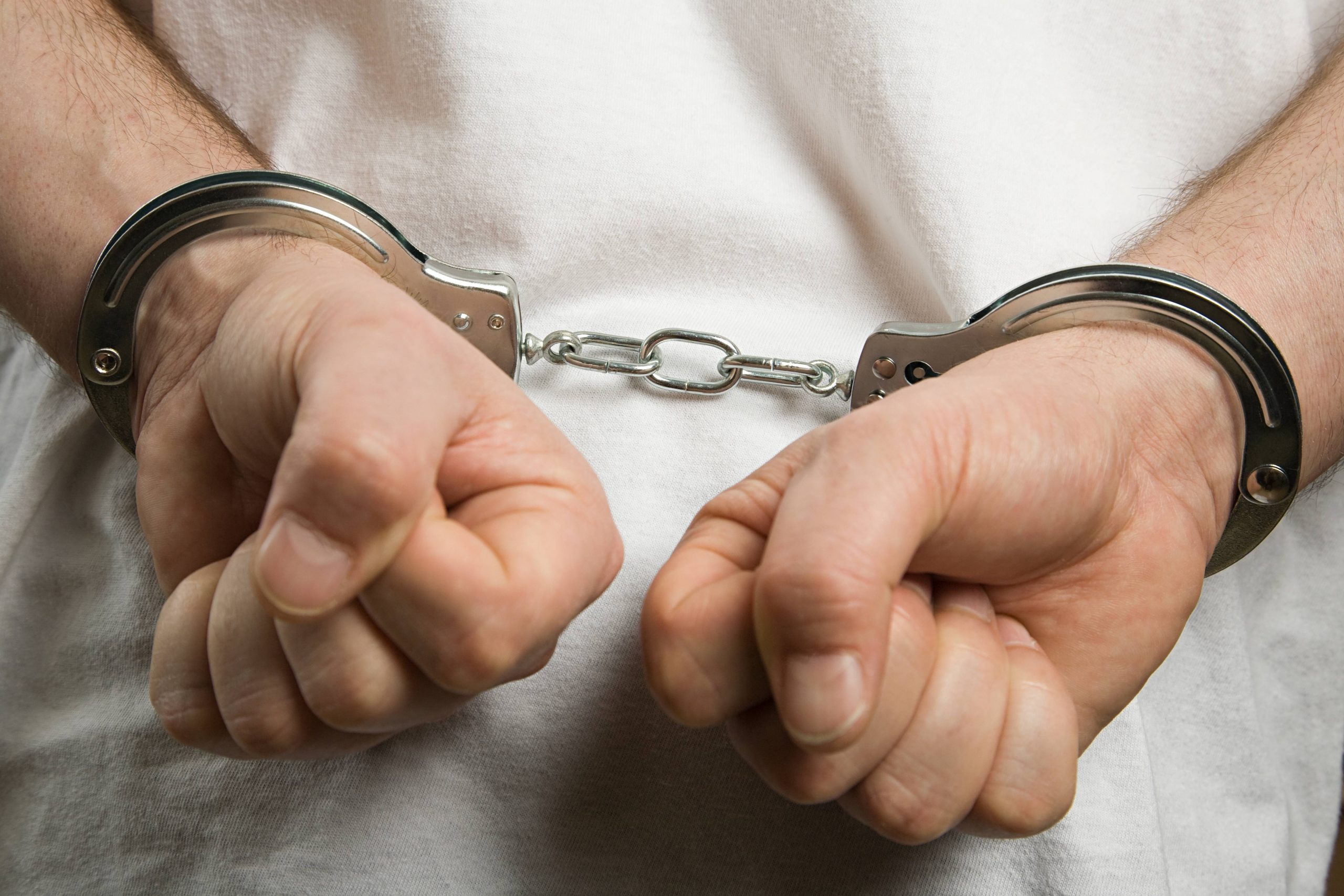 A Criminal Wearing Handcuffs
