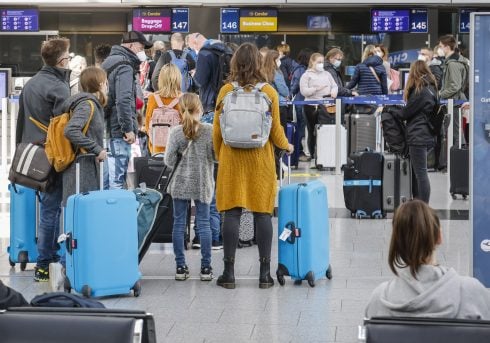 Holidaymakers At The Condor Check In Counter At Duesseldorf Airport, North Rhine Westphalia, Germany