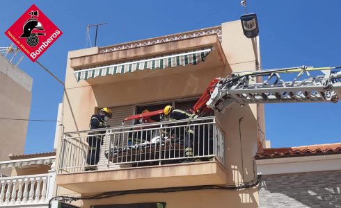 Firefighters Get An Overweight Man Out Of His First Floor Costa Blanca Apartment Window In Spain