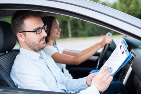 Instructor And Young Female Student, Driving Lesson