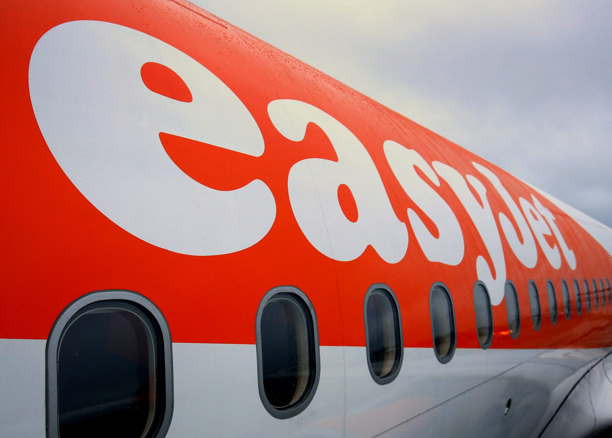 Heavily pregnant woman claims she was kicked off EasyJet flight from Belfast to Ibiza over row with staff along with every other passenger after they started chanting for AIR HOSTESS to be kicked off