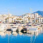 View Of Puerto Banus Marina With Boats And White Houses In Marbe
