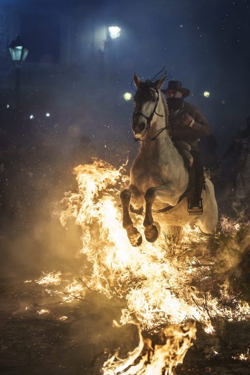 Horses are ridden through bonfires during the annual Festival of Luminarias in Spain