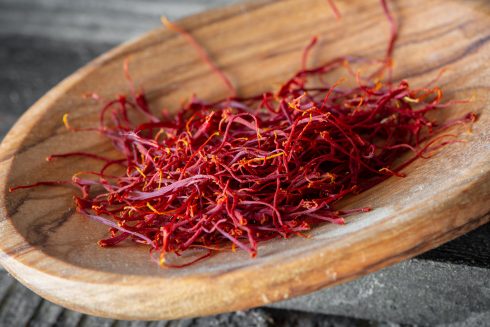 Close Up Saffron Threads On A Wooden Spoon