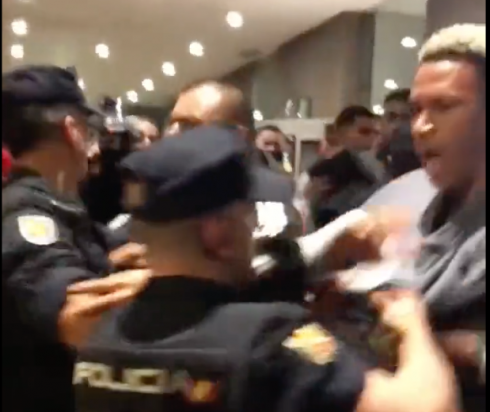 Scuffles between Spanish riot police and Peruvian footballers