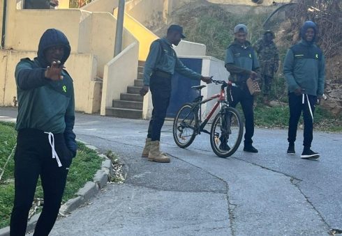 Migrants in Ceuta wearing Civil Guard clothing