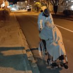 Ramon, 94, pushes his wife's wheelchair due to lack of ambulances