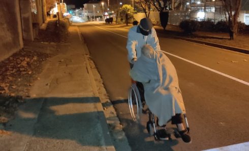 Ramon, 94, pushes his wife's wheelchair due to lack of ambulances