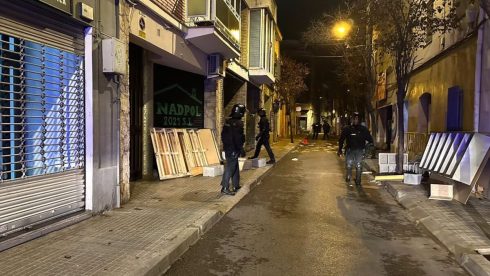 Young squatter in Spain faces losing her ARM after sticking it in a barrel of cement to avoid being kicked out during huge police raid on 'okupa' building