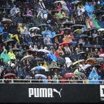 Valencia CF shelter from the rain at a recent match