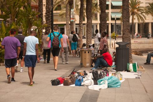 Tourist warning for Spain: Buying bags and other goods from ‘looky looky’ men could land you a hefty fine in this holiday hotspot this year