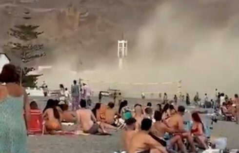 WATCH: Moment astonishing 'mini hurricane' sends beachgoers running for cover in southern Spain's Costa Tropical