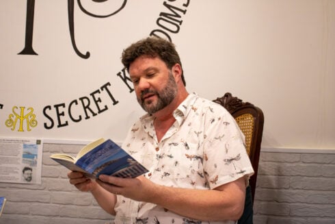 Matthew Clapham with his new book about Benidorm