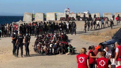The Spanish army corrals migrants on a Ceuta beach