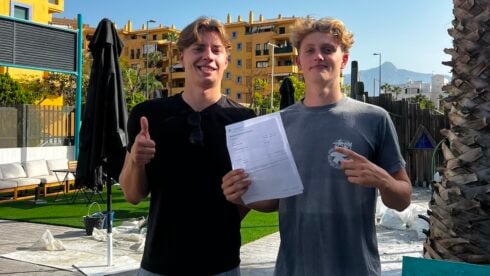 Two boys pose with A level results
