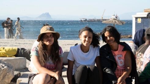 Female migrants on a beach in Ceuta