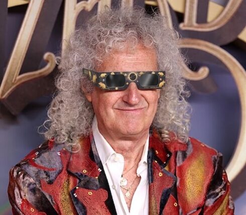 Brian May wearing eclipse glasses