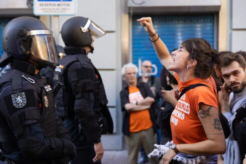 Protesters and police clash in Madrid outside the flat of Maricarmen