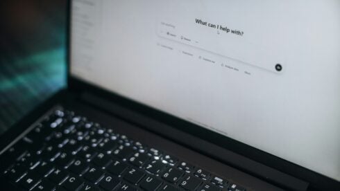 A bright laptop screen open on an LLM