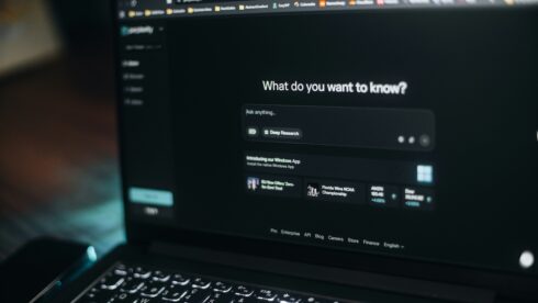 A dark laptop screen open on an LLM