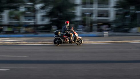 A motor scooter in a Spanish city