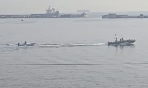 Migrant boat and Guardia Civil vessel in Gibraltar waters