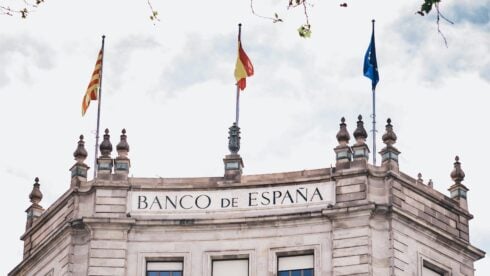 Banco de España building with flags flying above it
