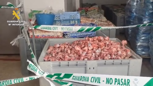 Rotten meat behind a Spanish police cordon
