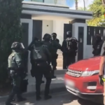 Spanish police officers during an operation against organised crime in Cádiz